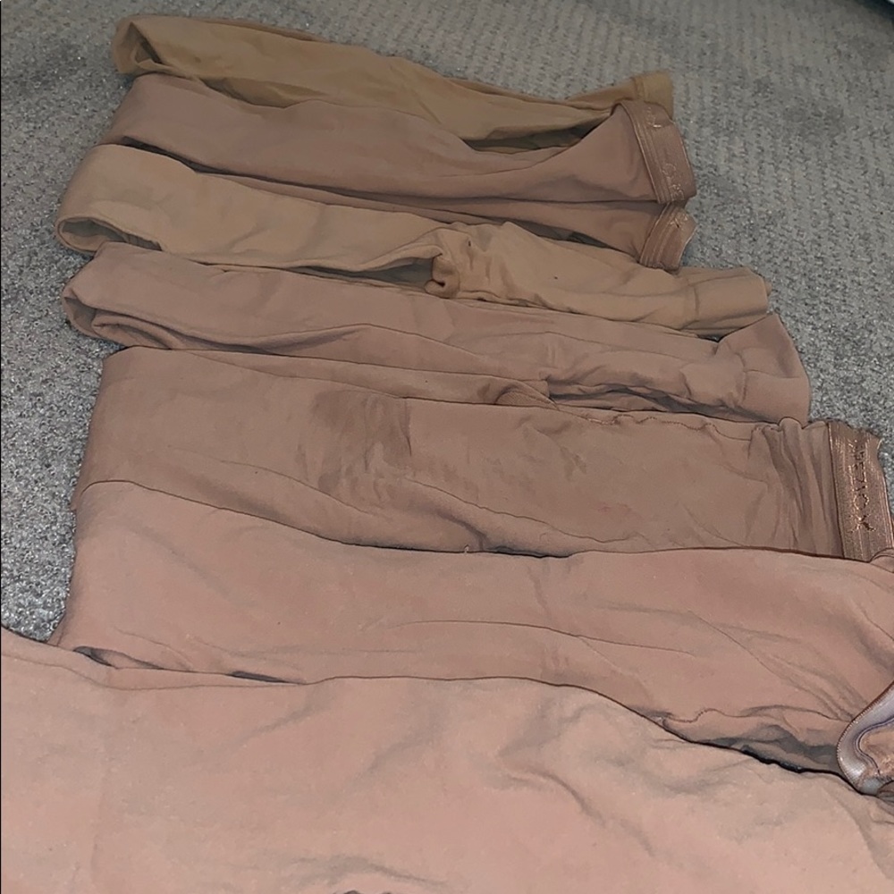 7 pairs of tan tights